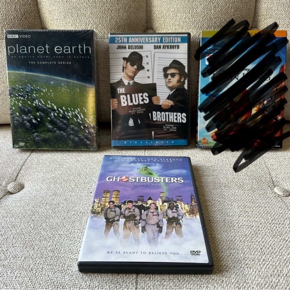 Lot 3 DVDs Planet Earth, The Lion King, The Blues Brothers, and Ghostbusters